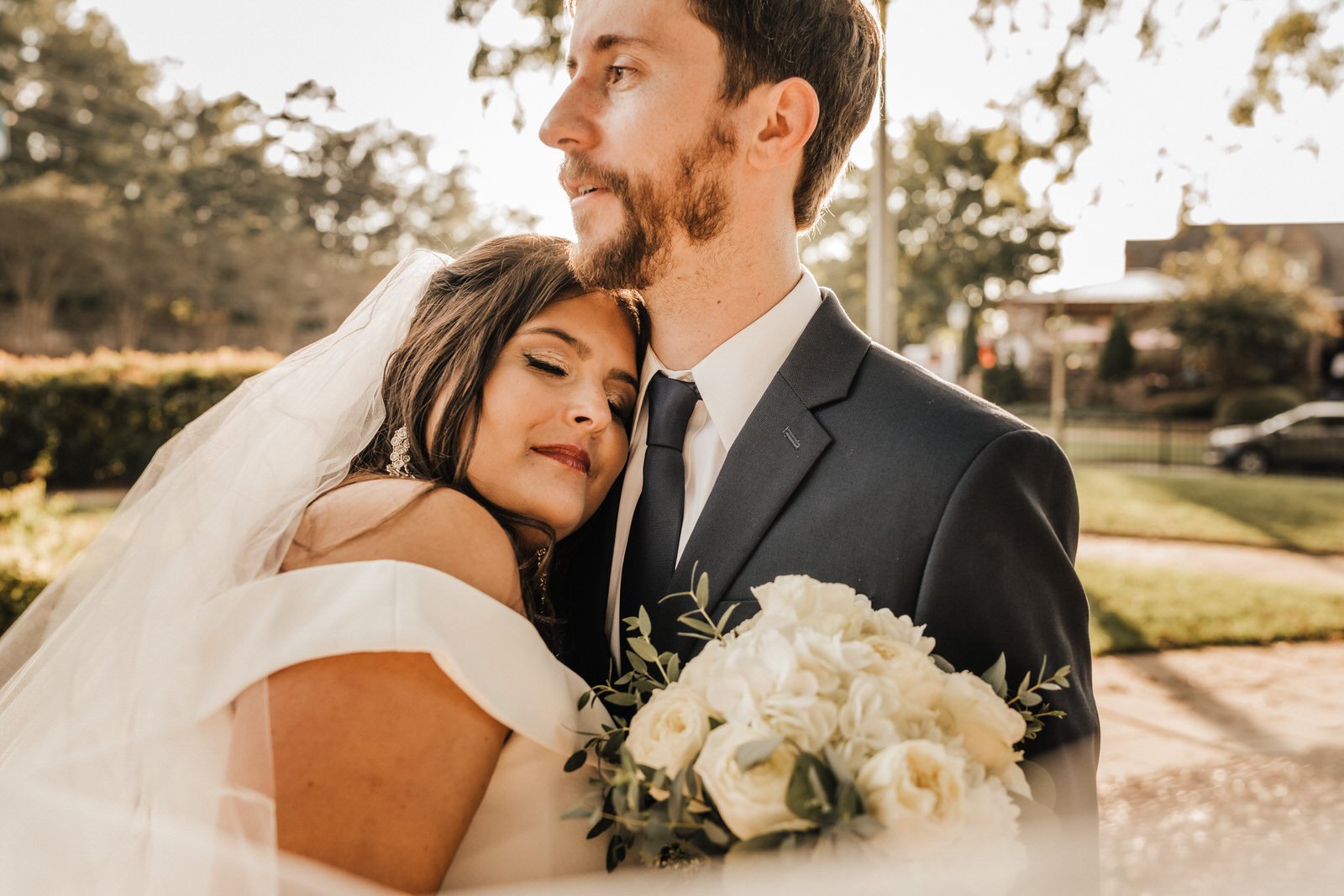 Georgia-Wedding-Bride-and-Groom-with-veil-at-Roswell-Town-Square (4).jpg