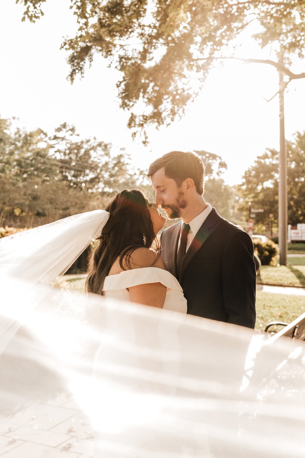 Georgia-Wedding-Bride-and-Groom-with-veil-at-Roswell-Town-Square (5).jpg