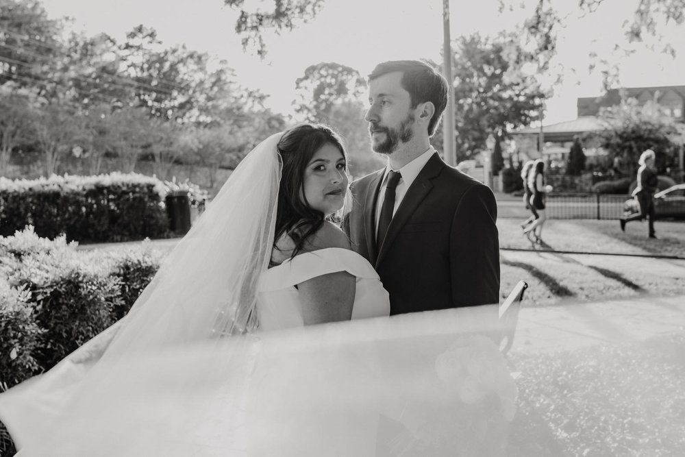 Georgia-Wedding-Bride-and-Groom-with-veil-at-Roswell-Town-Square (9).jpg