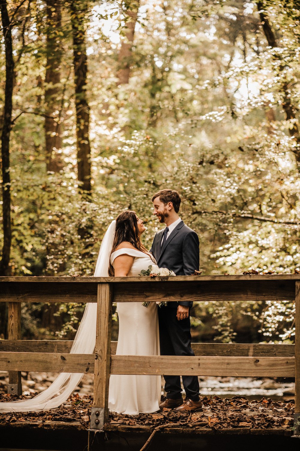 Woodsy-Georgia-Wedding-Bride-and-Groom-on-Bridge-Above-Creek-in-Roswell-Georgia (3).jpg