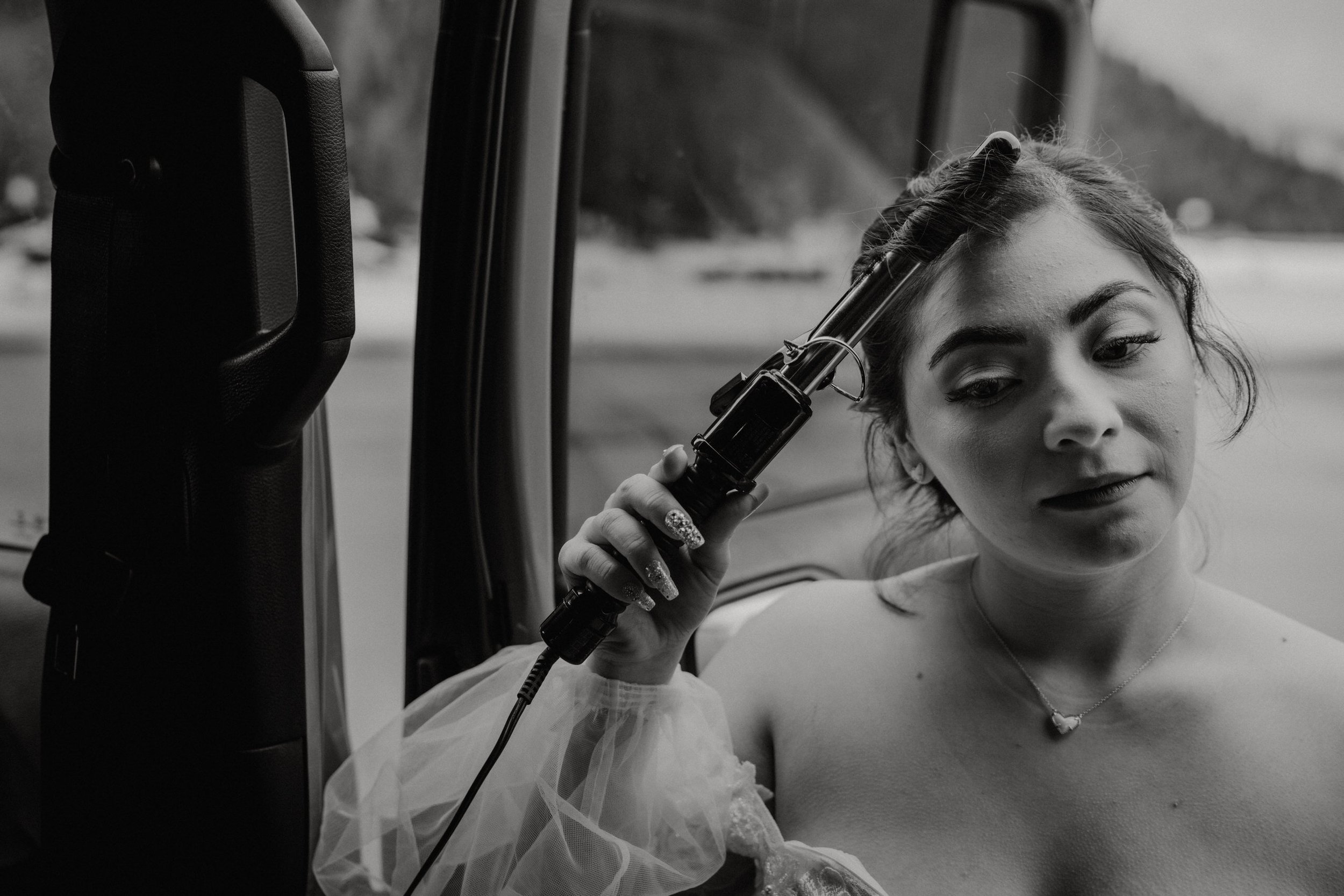 utah-mountain-elopement-bride-curling-hair-in-jeep-wrangler.jpg