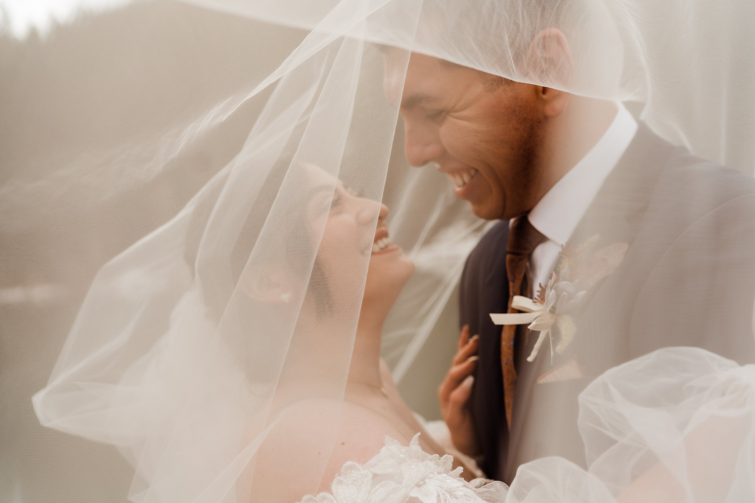 utah-mountain-elopement-cute-laughing-photo-of-bride-and-groom.jpg