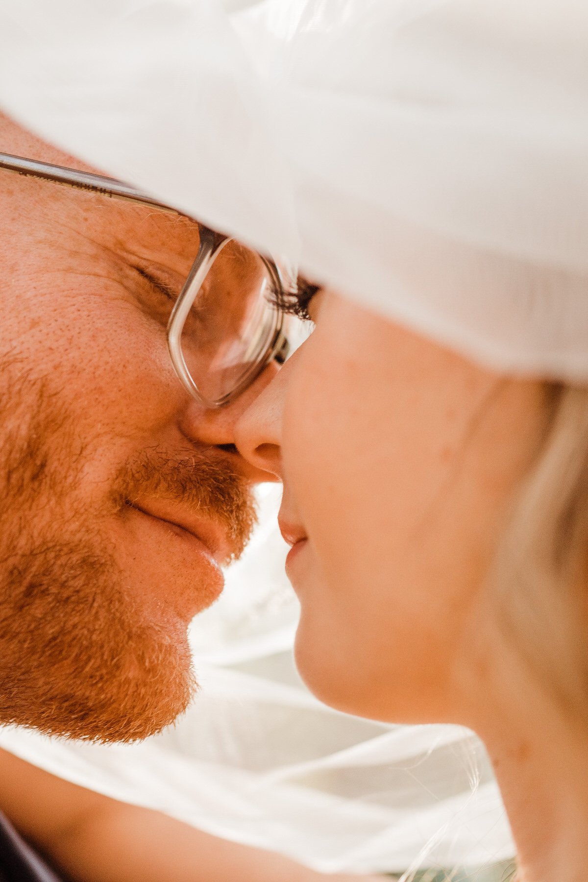 Bride-and-Groom-Photos-in-Redwoods-Groom-in-Glasses-with-Bride-under-Veil.jpg