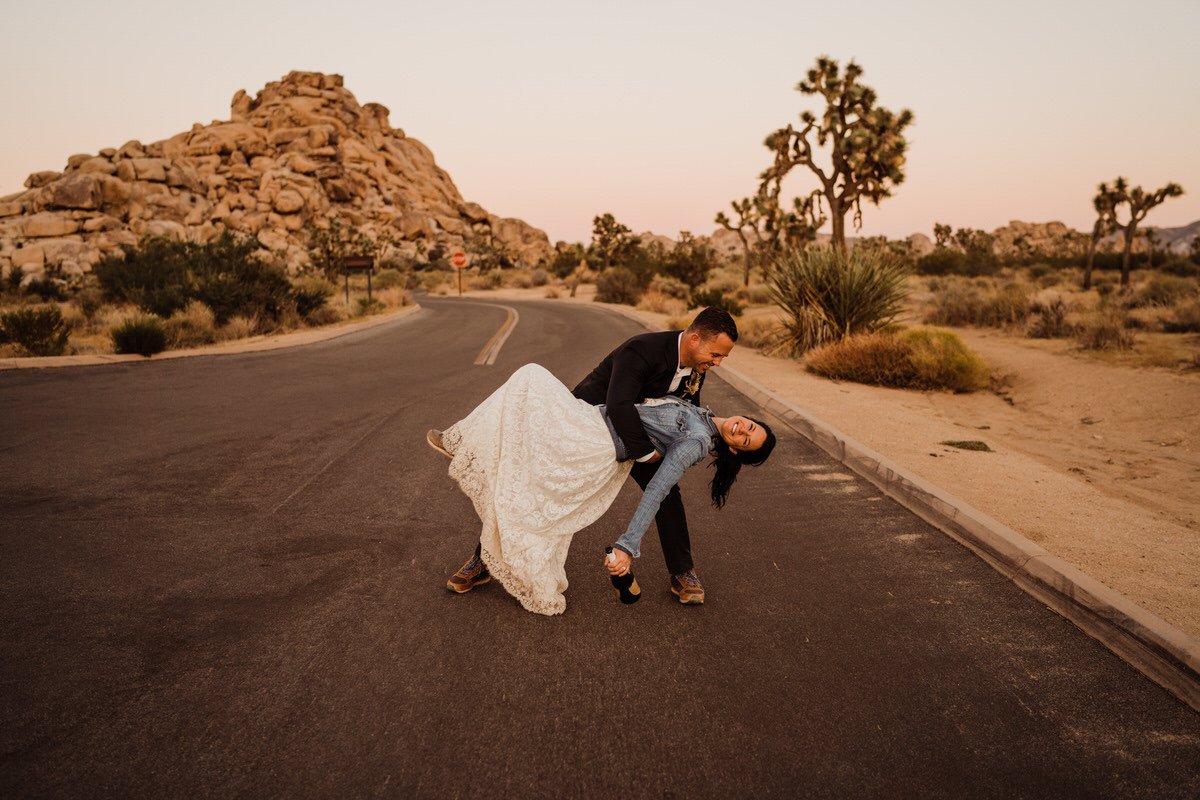 Groom-Dipping-Bride-with-Champagne-at-Joshua-Tree-sunset.jpg