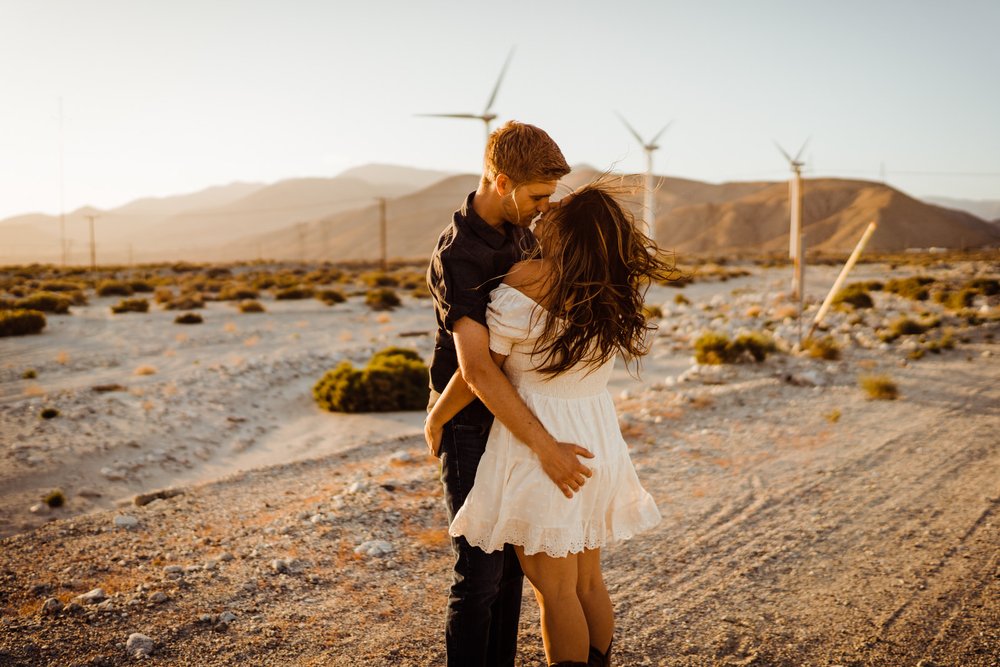 Palm-Springs-Engagement-Romantic-Photos-at-Golden-Hour-desert-with-windmills.jpg