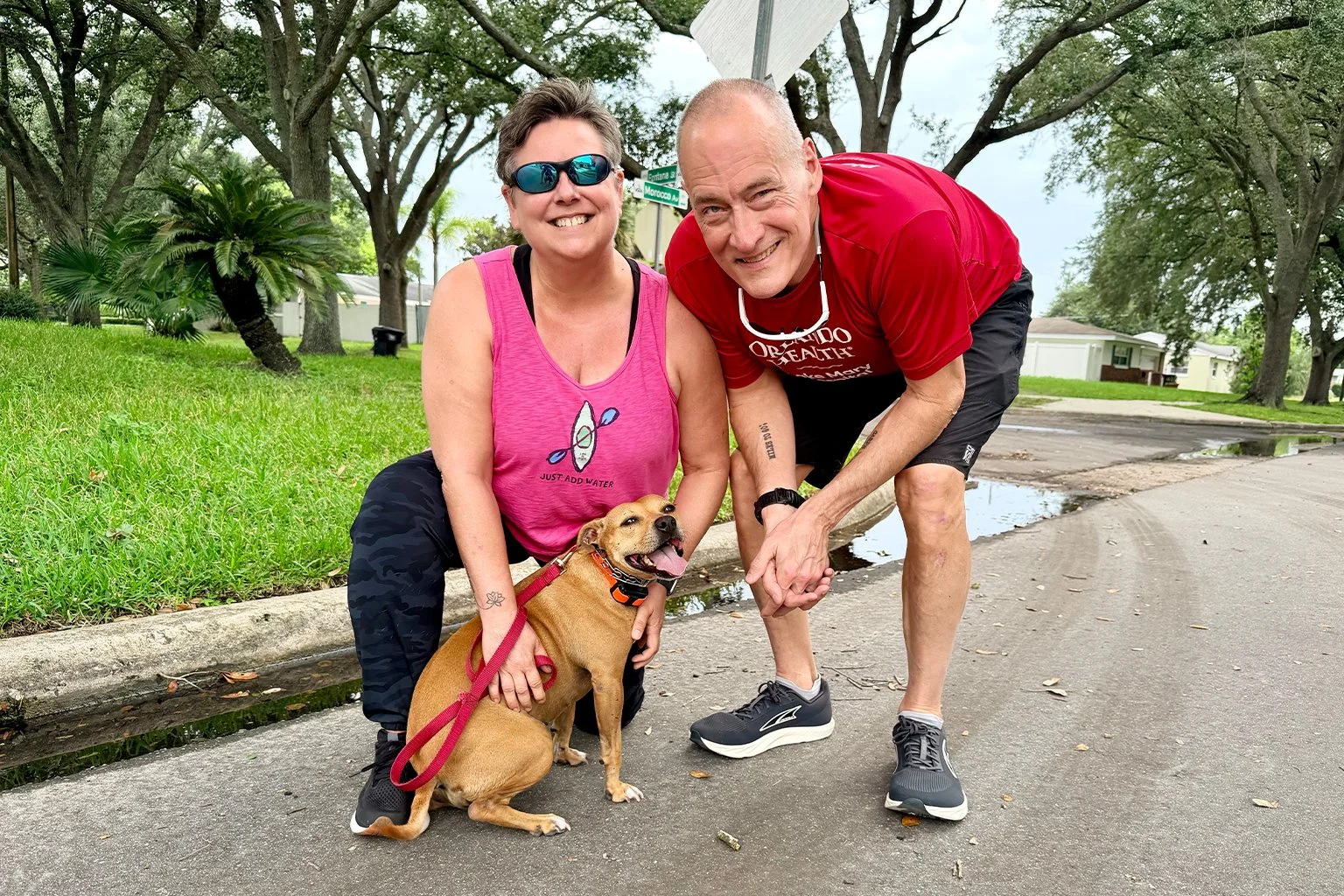 Nita with her family after completing dog aggression and behavior rehabilitation training with PAWSitively Calm in Orlando, Florida.