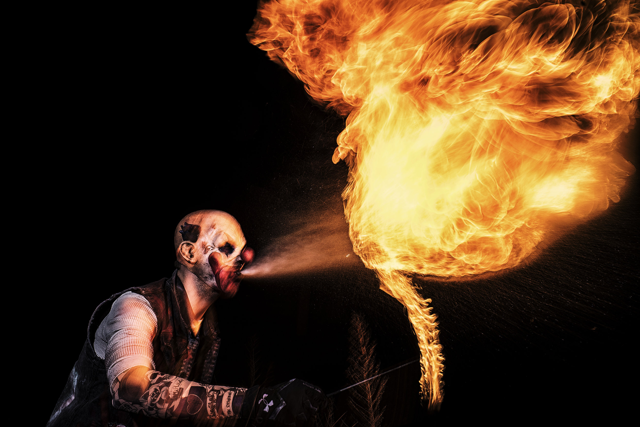 Chris Oppedahl, a Circle of Ash Scream Park volunteer, practices fire-breathing on March 15. Oppedahl has volunteered with the organization for approximately a year and goes to weekly meetings as often as possible.(James Year/The Daily Iowan)