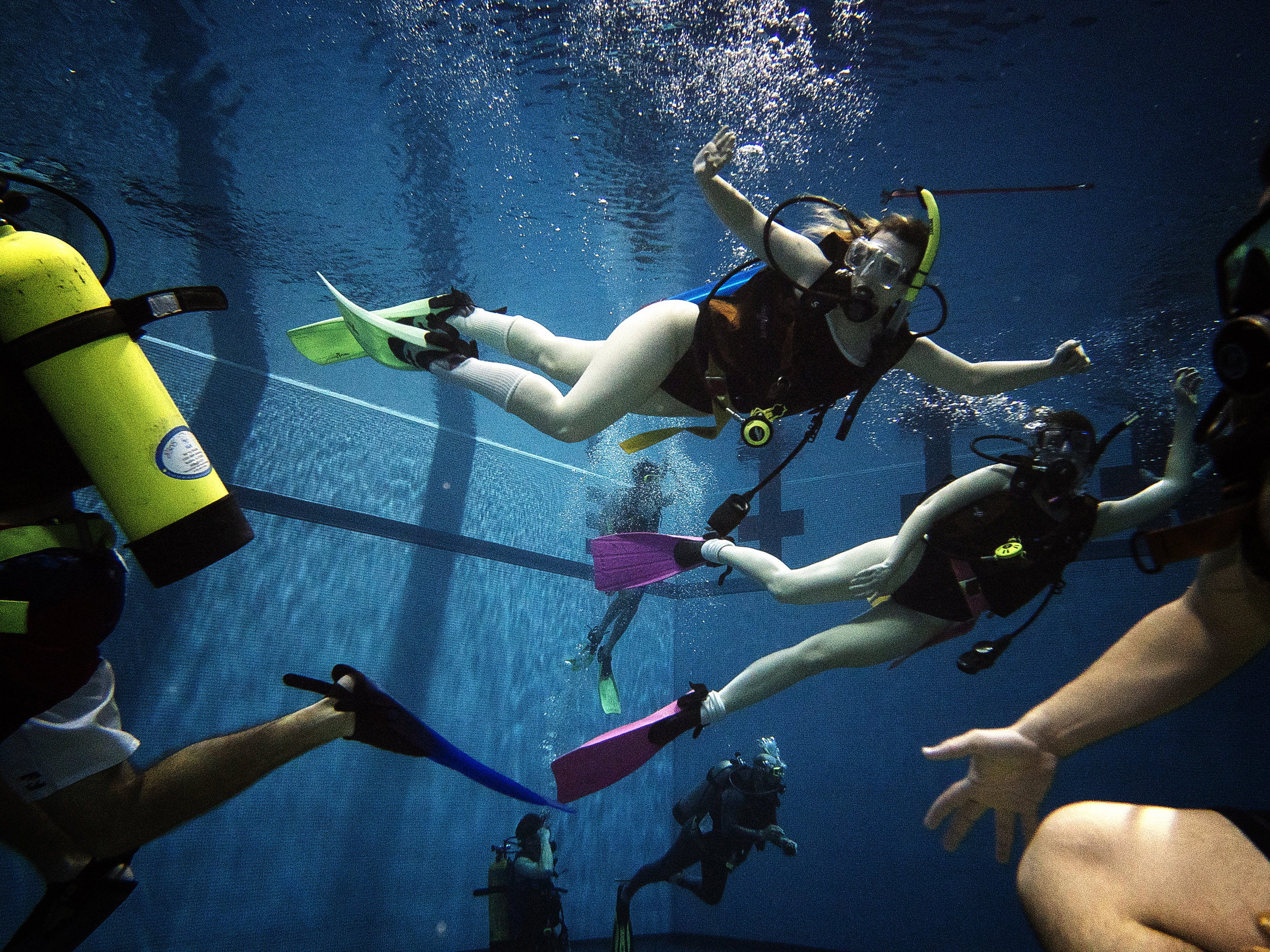 Students enjoy a period of free swimming at the CRWC in Iowa City on Tuesday, April 24, 2018. This was one of the class' last practice sessions before their open water certification at Lake Pearl, Illinois this summer. (James Year/The Daily Iowan)