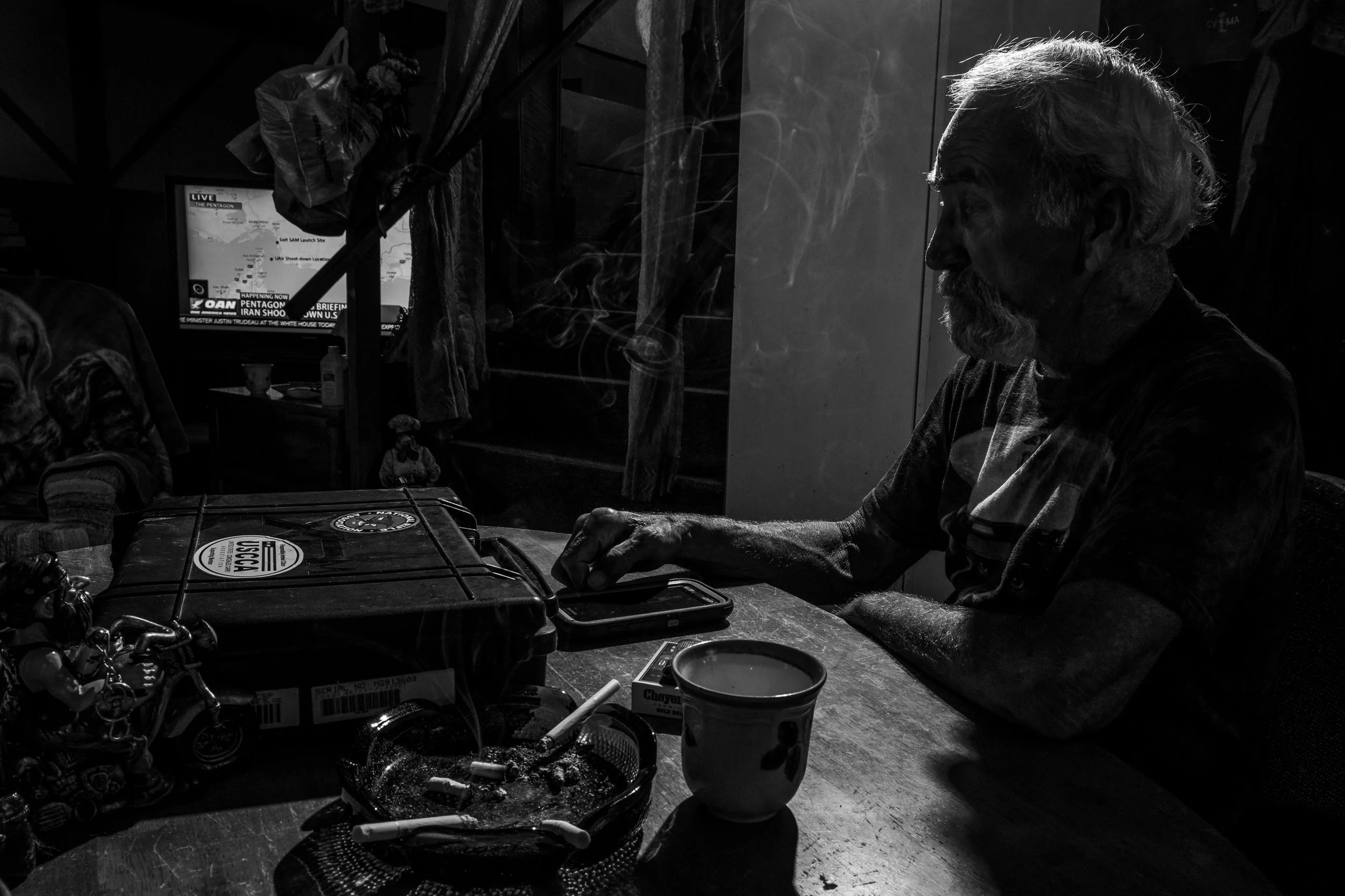 Marine Corp veteran and Patriot Guard Senior Ride Captain, Bill Walden, smokes a cigarette in his home on Thursday, Jun. 20, 2019. Walden served 12 years in the USMC in crash, fire, and rescue and served a tour at Khe Sanh in 1967 before being medically retired due to an accident in 1972.