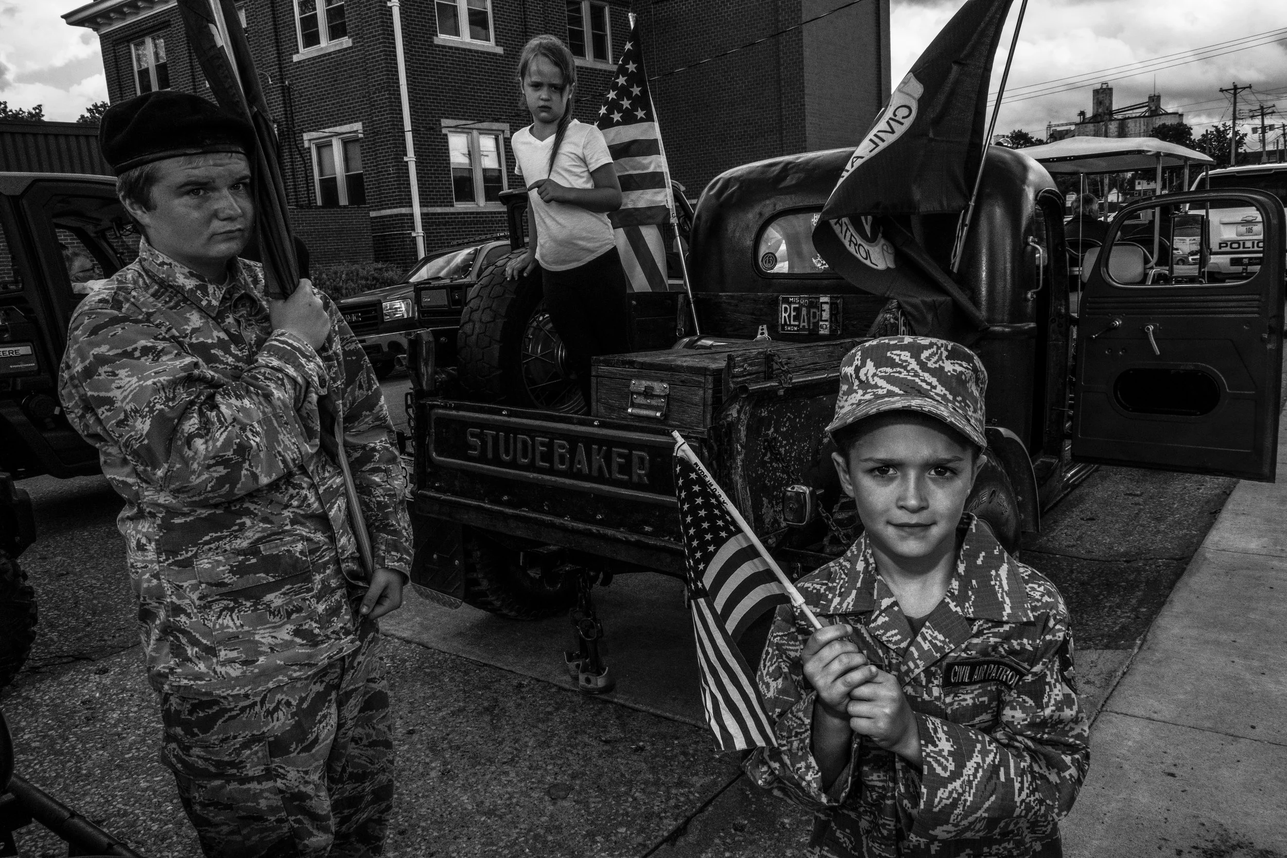 The Zumsteg kids pose for a portrait during the Real American Heroes parade in Mexico, Missouri on Wednesday, Jun. 2019.