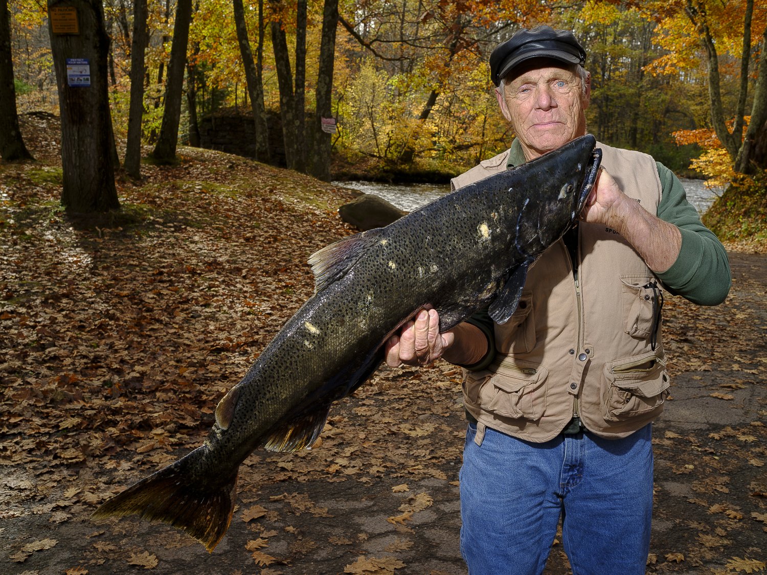  Herman Peterson, an antiques dealer of Richmondville, New York poses with a King Salmon at the Pineville River Landing.   Eric Geary, a local river guide from S.W.A.T Fishing said, “I mean, this is a blue-collar fishery. We have our doctors and lawy