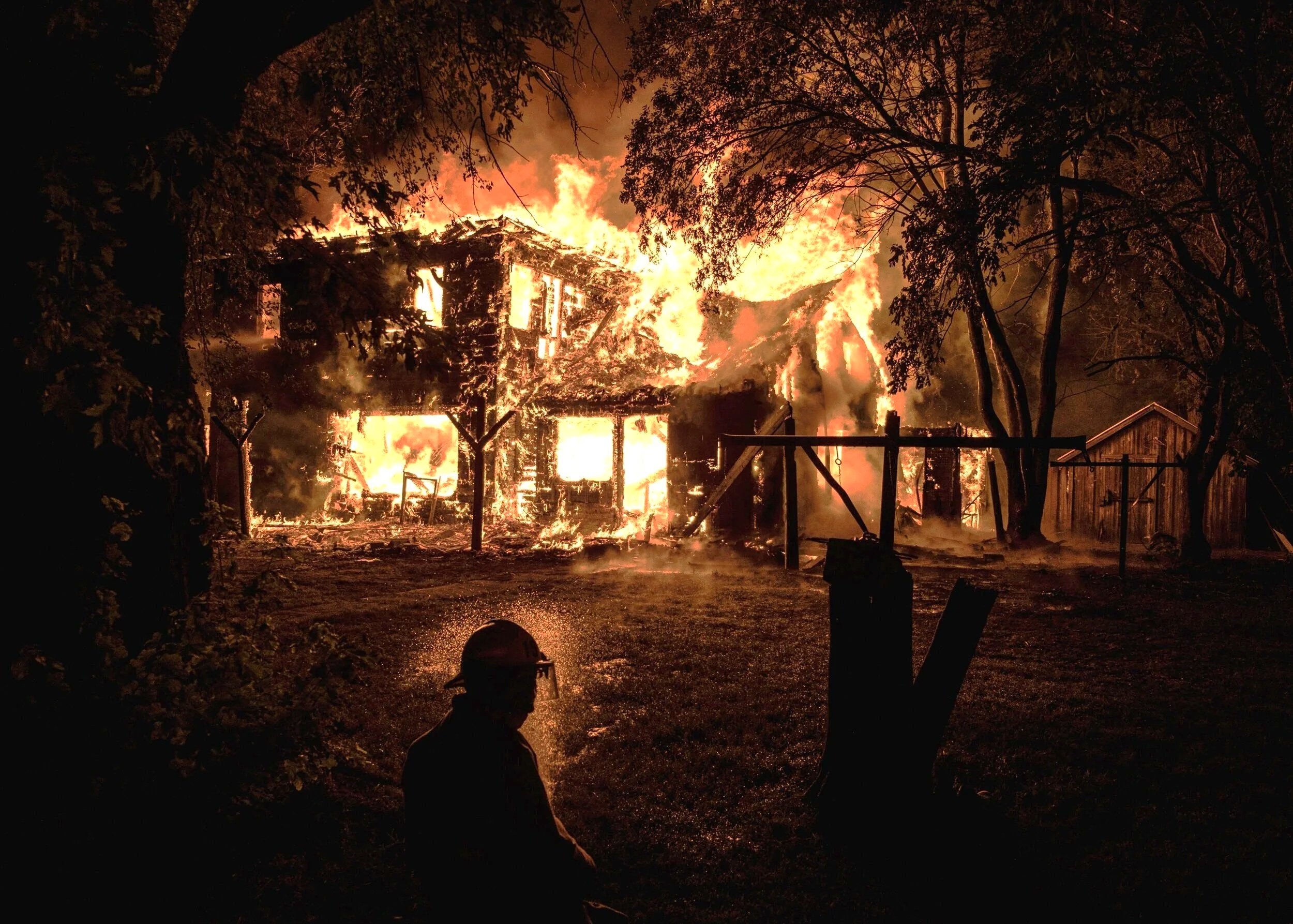  Local volunteer firefighters from multiple departments conduct a controlled burn on a farmhouse for training near Sheldon, Iowa on Thursday, Aug 15, 2019. Controlled training burns used to be much more common in the area until insurance and environm