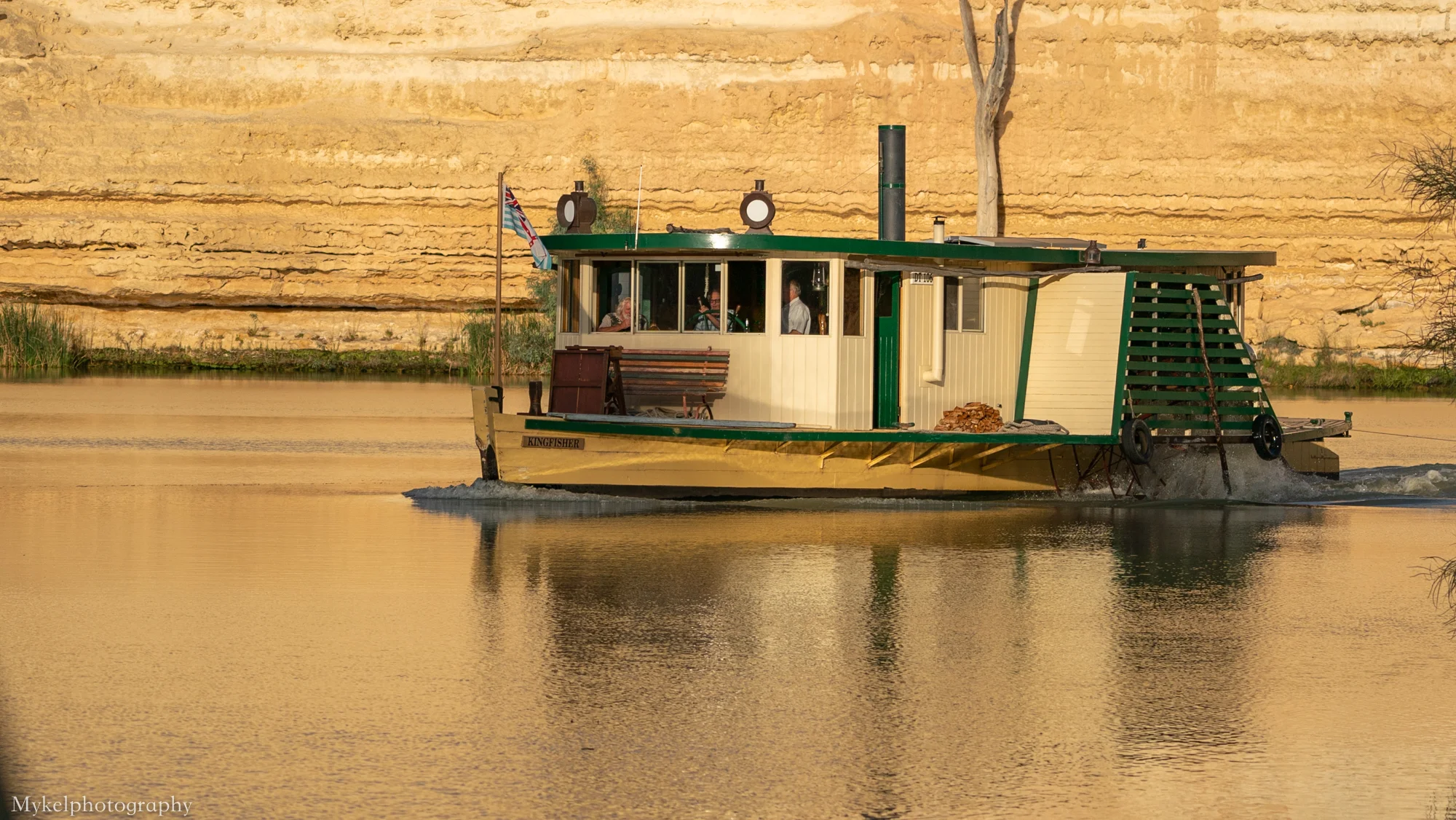 A beautiful old paddle steamer “Kingfisher” cruises by