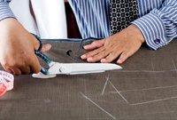 3. Cutting the Cloth: Follows on from the pattern being chalked onto the fabric. Each part of the pattern laid in order to ensure that checks and stripes will neatly line up.