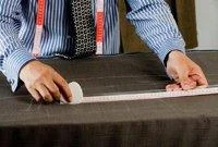 6. Alterations: A new pattern is cut, accounting for any alterations noted in the first fitting. The baste is then ripped down, remarked using the new pattern, and re-cut.