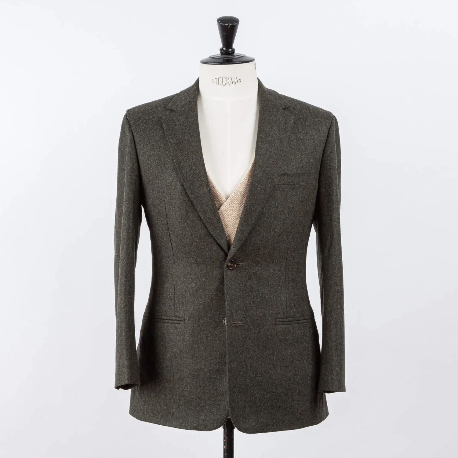 Dark green three-piece wedding suit with beige waistcoat