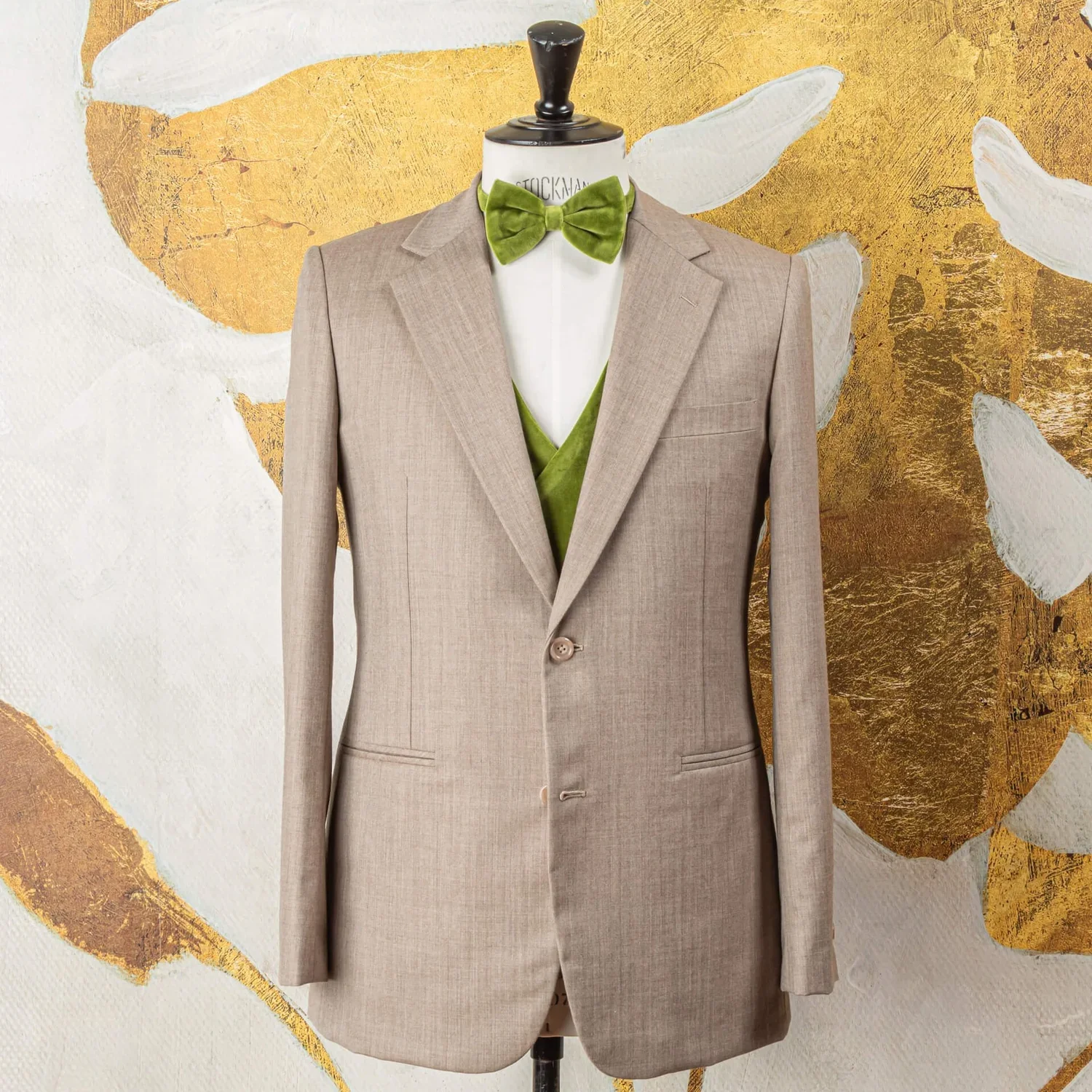 Beige three-piece wedding suit with green velvet waistcoat