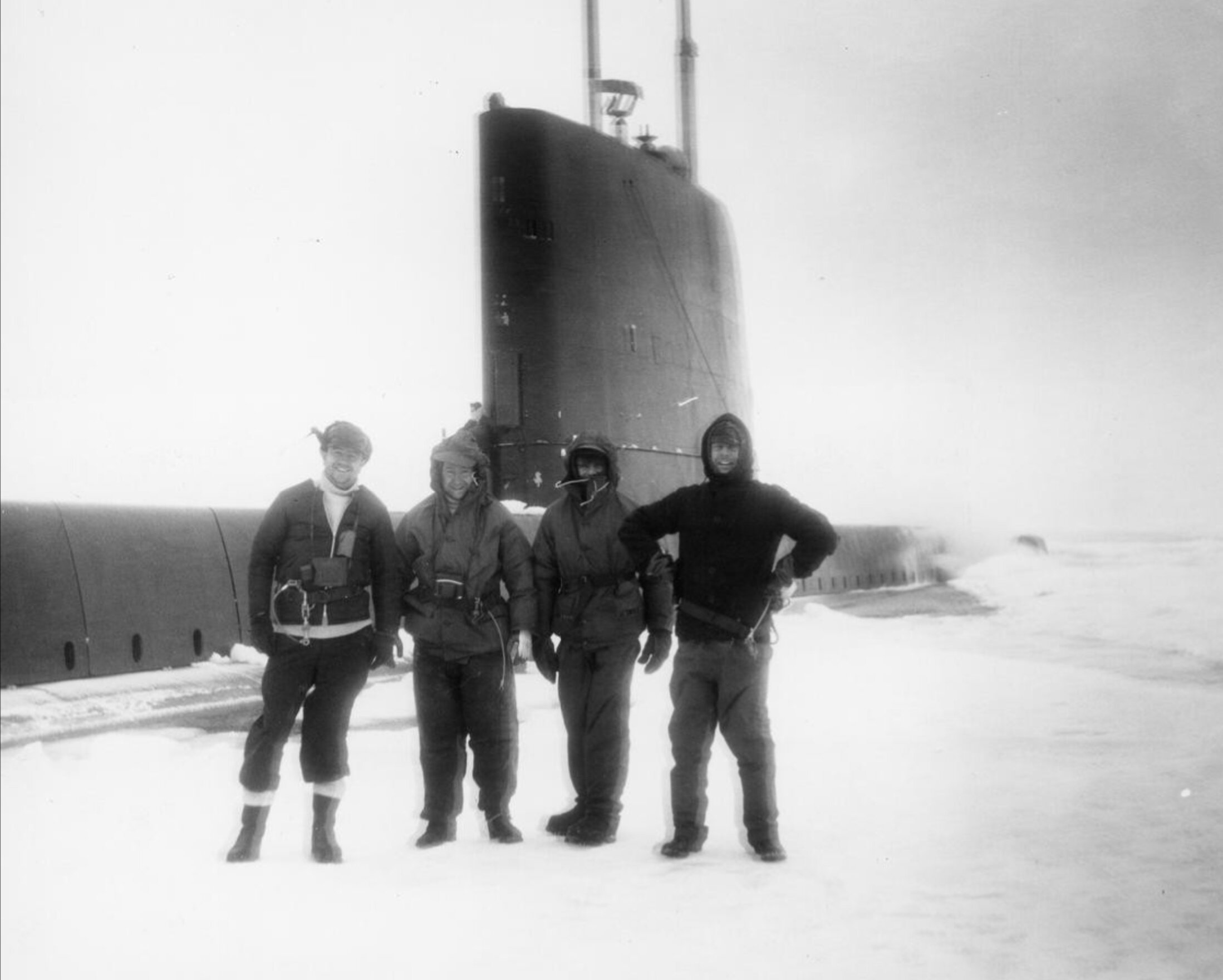 During Exercise Portent, Lt Cdr Owen, Commanding Officer of HMS OPOSSUM and members of the crew ashore on the pack ice at 76 degrees north, the furthest a conventionally powered submarine had been..jpg