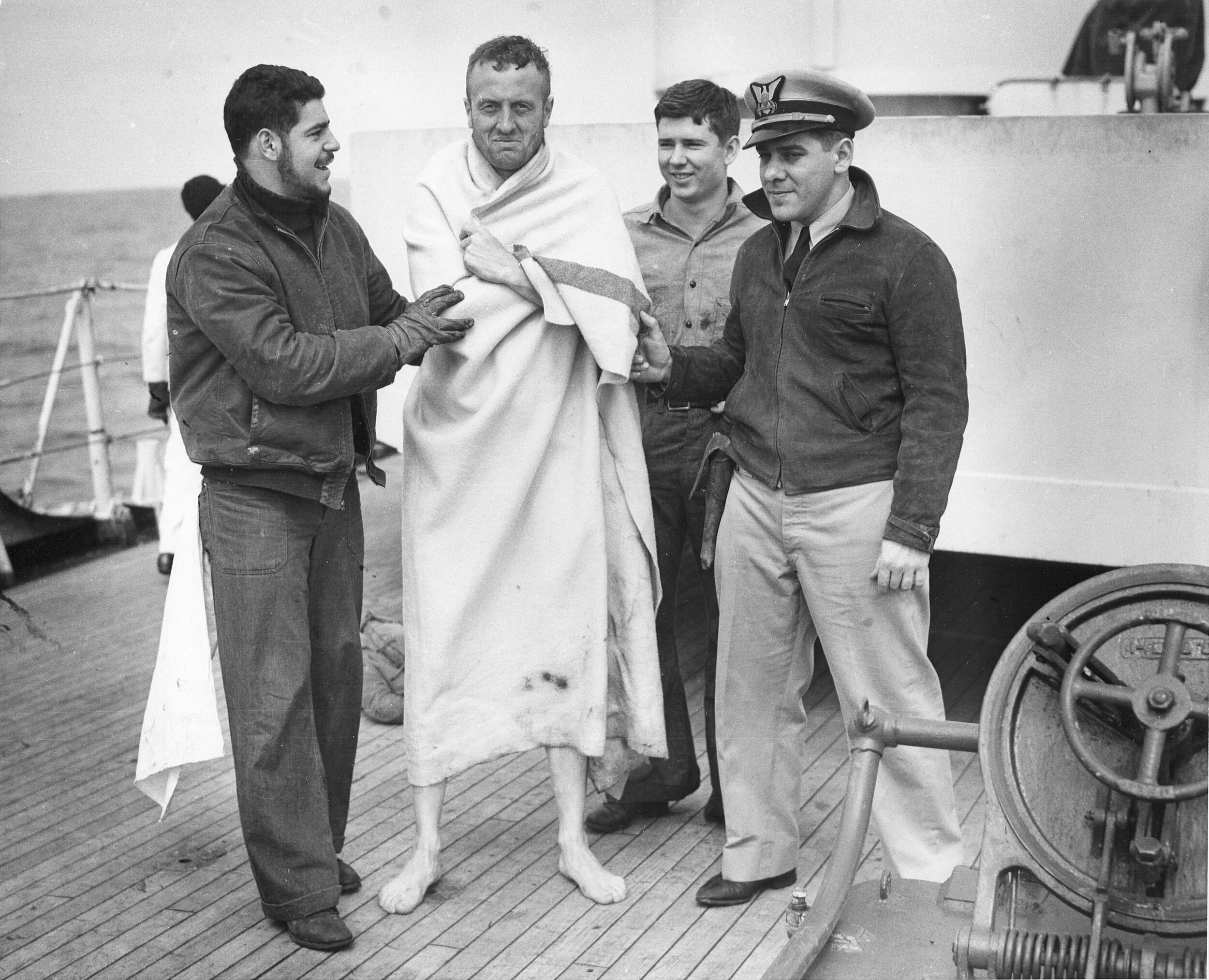 Crew of USS Spencer cared for rescued U-175 sailors, North Atlantic, 500 nautical miles WSW of Ireland, 17 Apr 1943.jpg