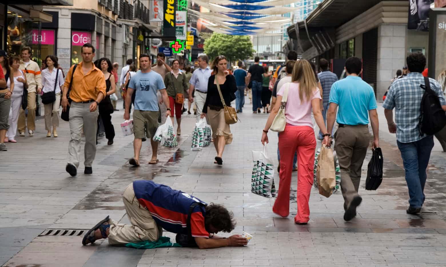Reach out, raise money or remove: how should cities deal with street begging?