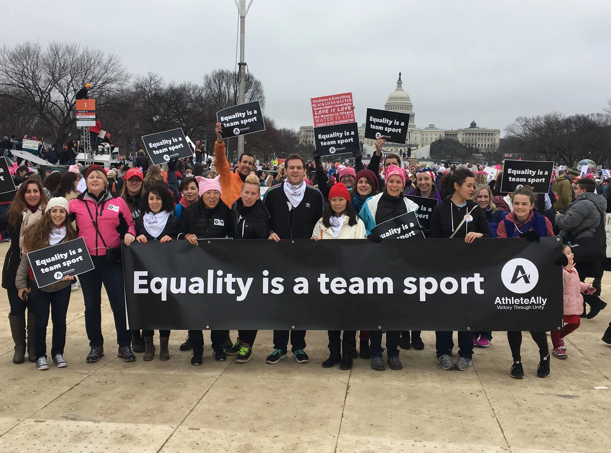 Athlete Ally with a banner in front of the U.S Capitol building.