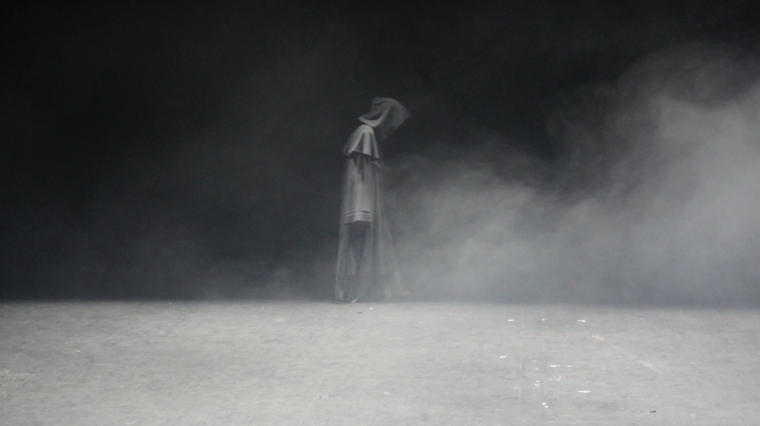 Figure Crosses Stage.JPG