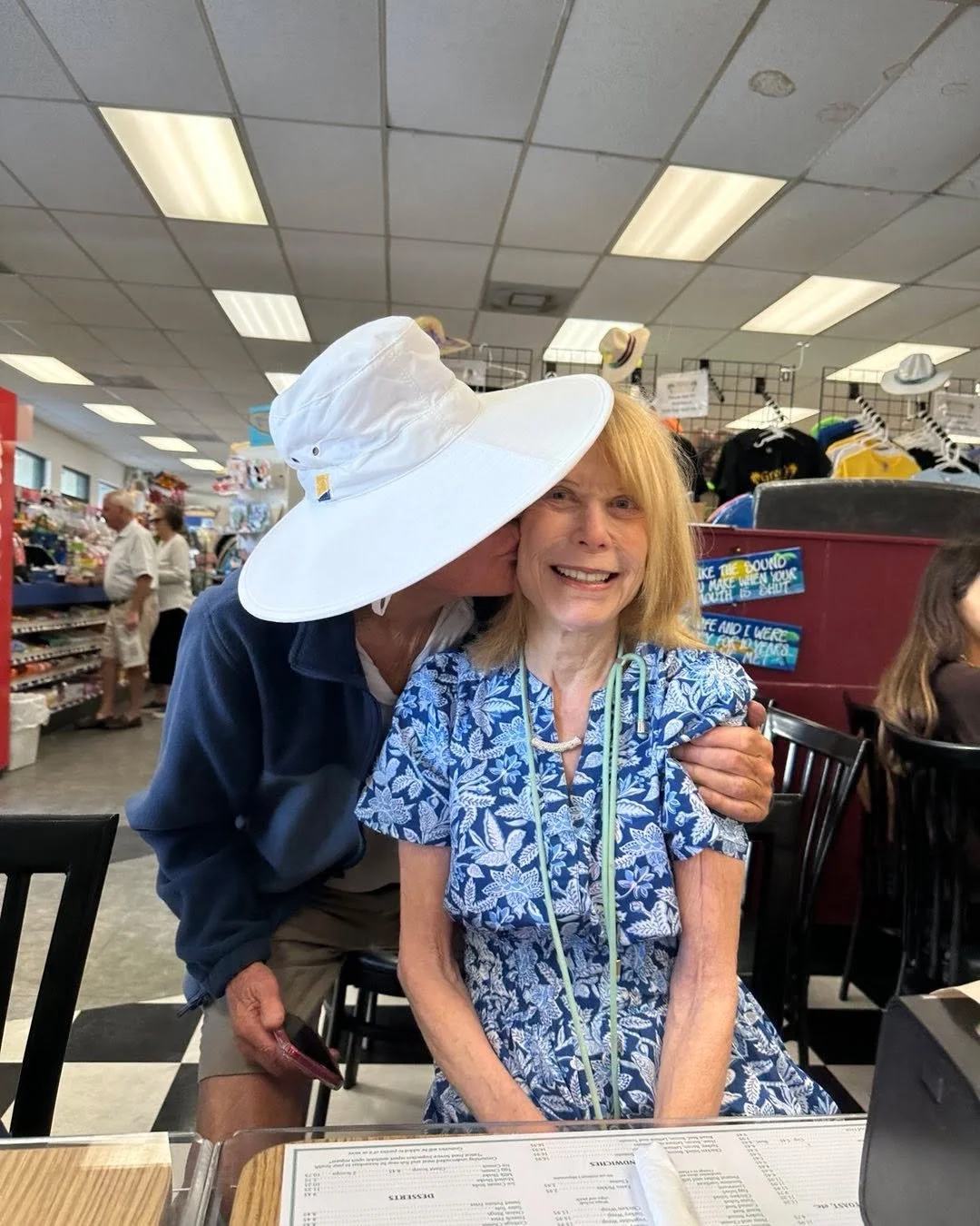 Who is the mystery person wearing  my (?) hat?