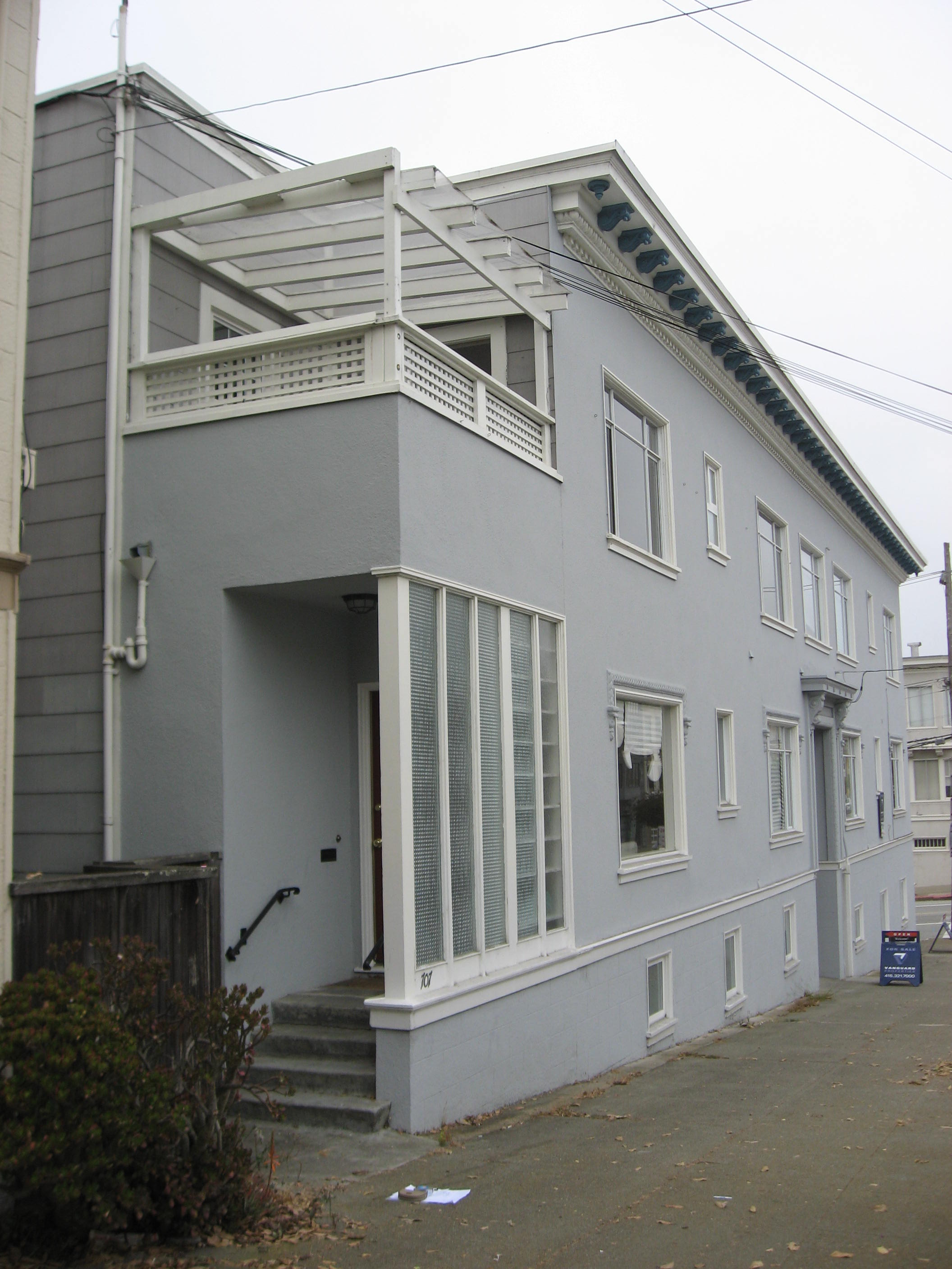 Existing entry and planting before remodel