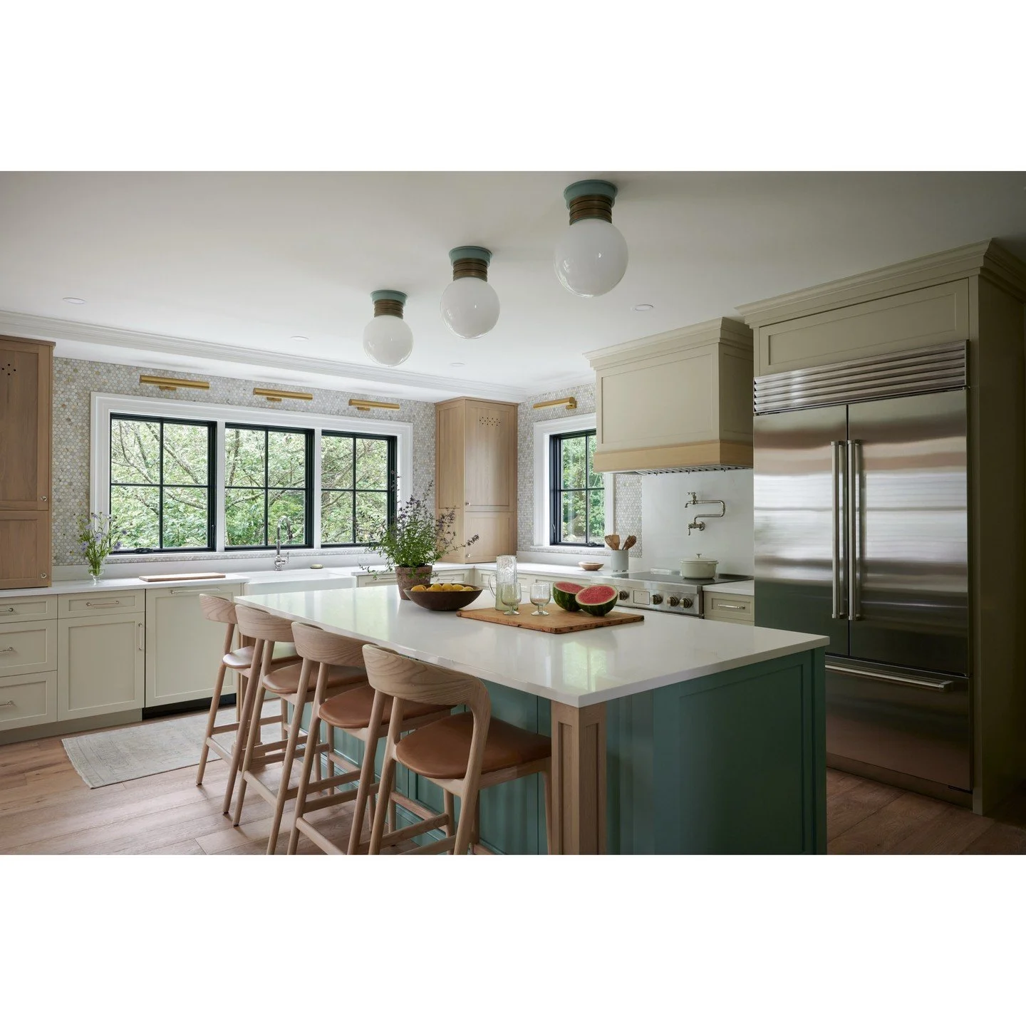 Once the kitchen took the place of the casual dining room, everything fell into place! 
Bringing in groceries became easier, entertaining became more effortless, and sightlines across the property opened right up. Now this space truly works for the w