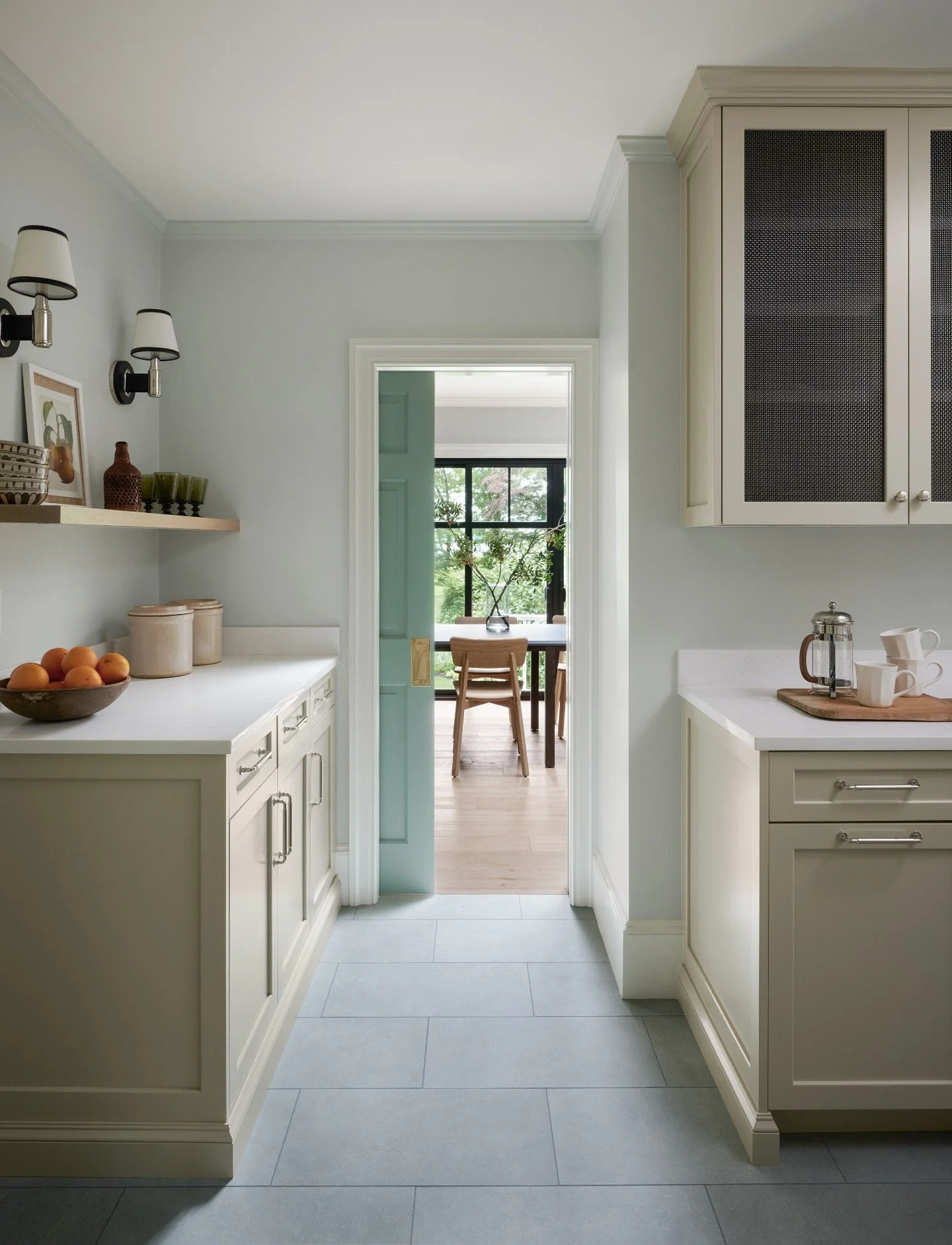 Tucked away, but working overtime:  This butler&rsquo;s pantry&mdash;with its hidden pocket door&mdash;keeps everything flowing behind the scenes while still feeling beautifully connected to the rest of the home. Extra prep space, thoughtful storage,