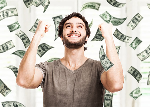 tax refund money raining down on happy man.jpg