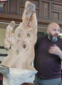  - Discussing the stages of making viewing sculptures for gardens. The piece shown is a Cherry slab sculpture in early stages of carving the design.