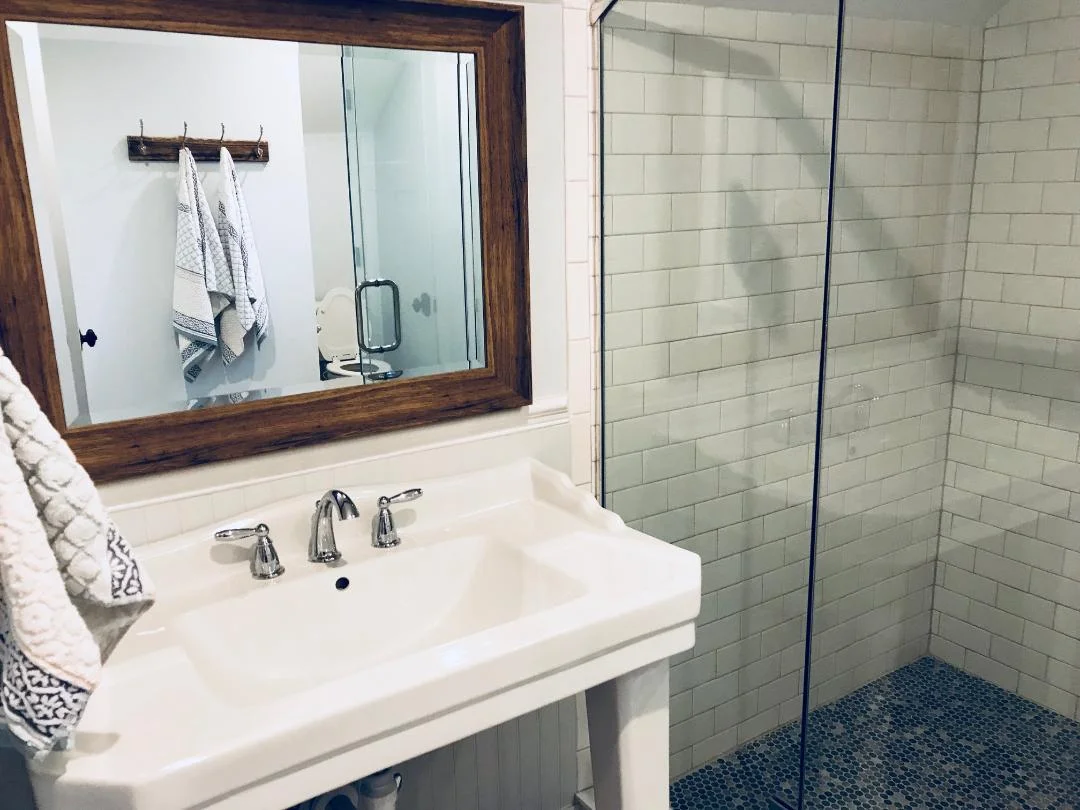 Subway & Penny Tile: Another common tile trend in the early 1900’s was white subway tile walls and penny tile floors. Which is why we decided to use the classic look in our master and guest bathroom.