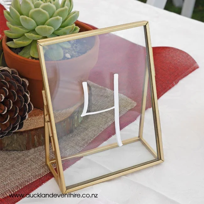 gold-brass-glass-frame-table-numbers-auckland-wedding-event-party-hire-rent-table