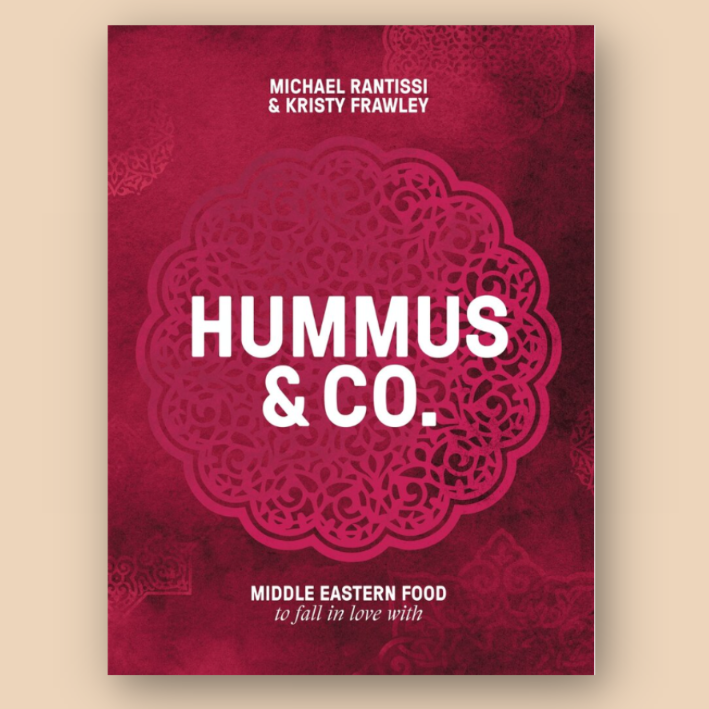 "Hummus & Co." cookbook cover by Michael Rantissi and Kristy Frawley, featuring Middle Eastern food theme.