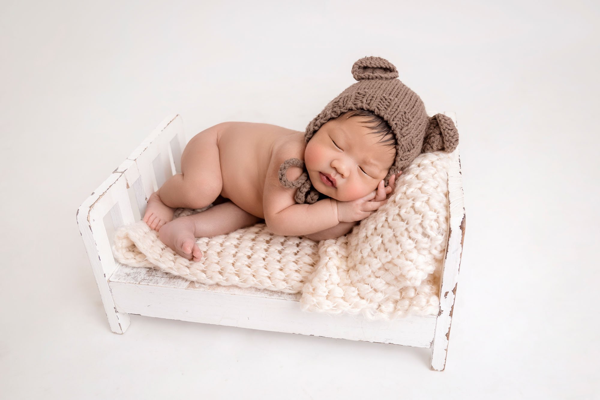 Newborn-photography-in-leeds-baby-on-bed-.jpg