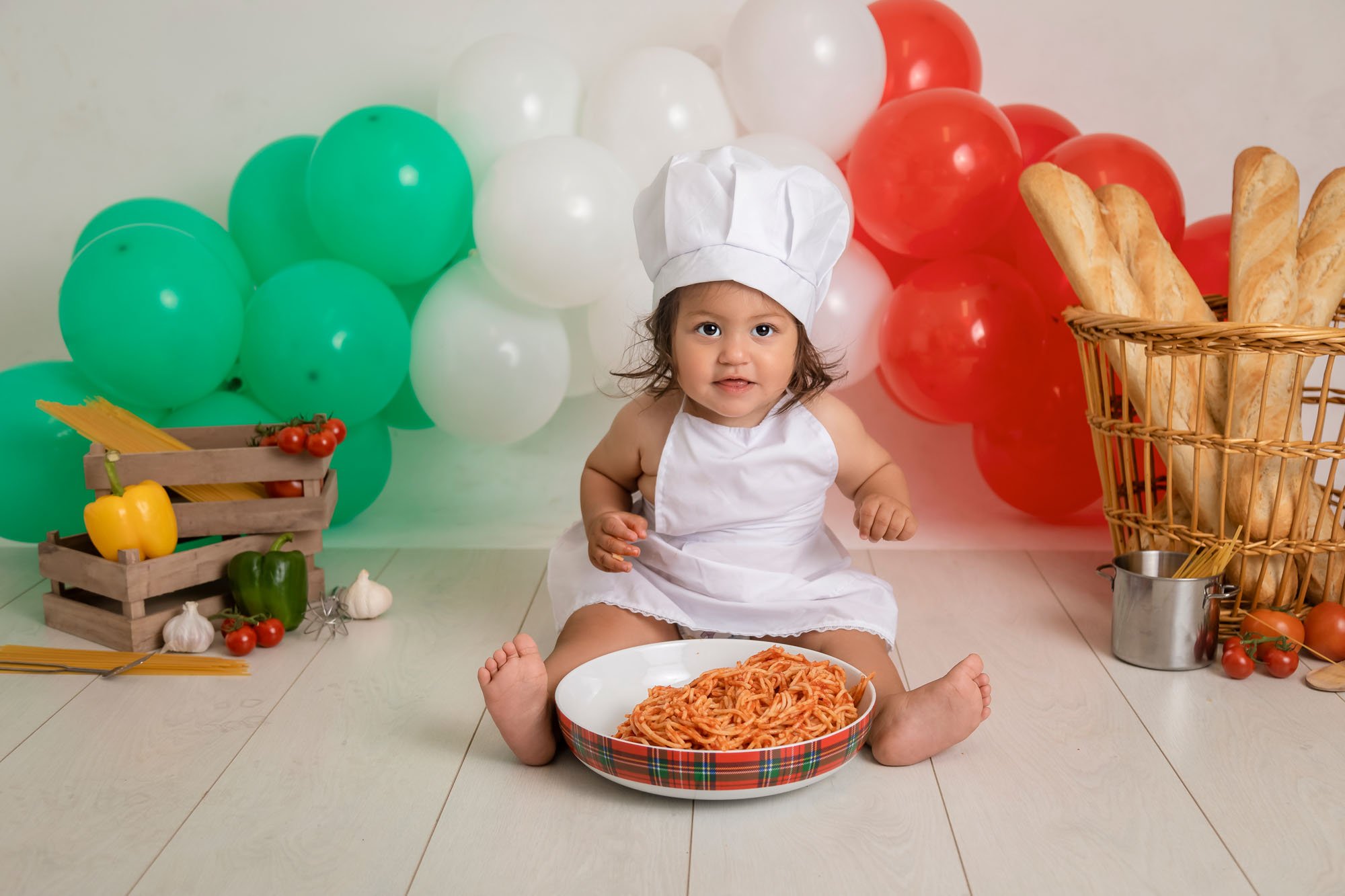 cakesmash-photography-in-leeds-baby-girl-spag-bol-smash-italy-breadsticks-spaghtetti-apron-chef-hat.jpg
