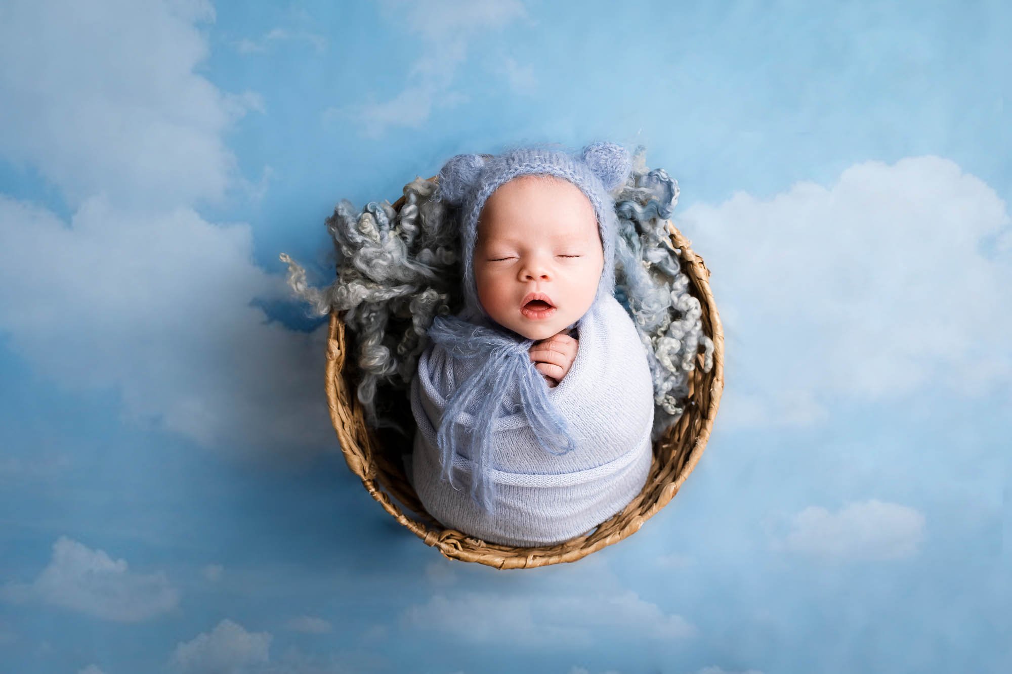 newborn_photoshoot_in_leeds_baby_boy_wrapped_clouds_blue.jpg