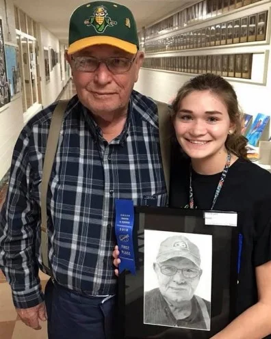 Isabelle Bryant with her winning entry and its subject, Richard Gates,&nbsp;her late grandfather .