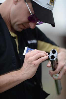 Carl Wojtaszek does gun maintenance.JPG
