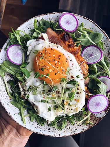 Using leftover sweet potato mash we made patties and fried them in avocado oil to make delicious little hash brown things. Topped it with an egg, radish and micro greens. So good!