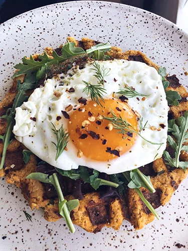 I turned the salmon cake recipes from the whole30 book into a waffle and topped it with arugula, a fried egg, dill, salt, pepper and chili flakes. It was delicious and super filling.