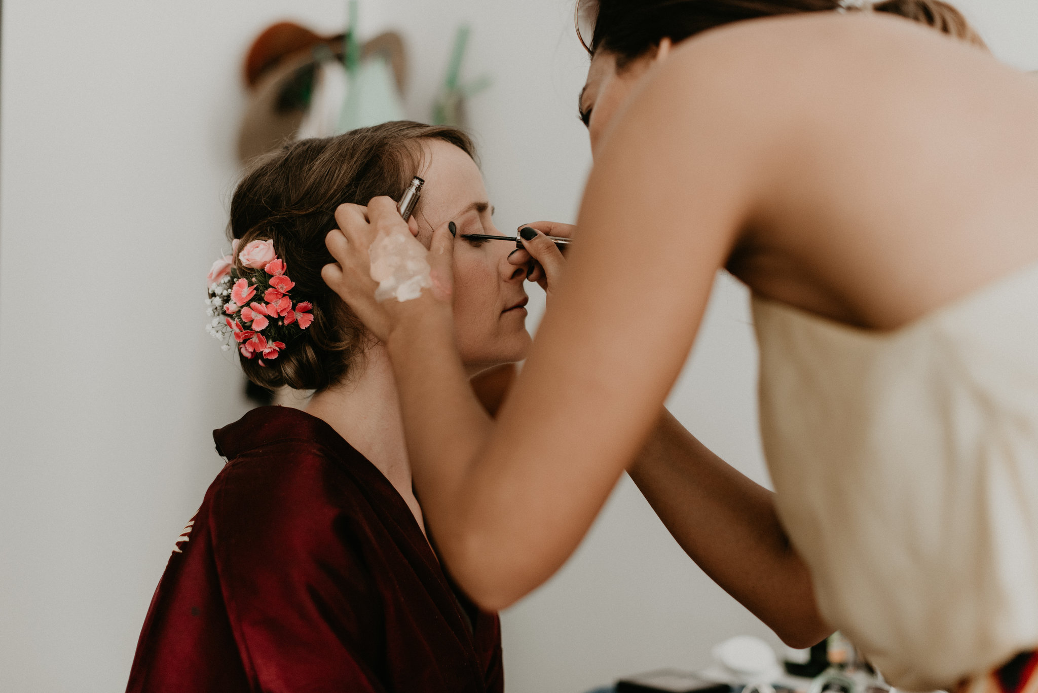 Rotterdam Bride getting her makeup done in a red robe
