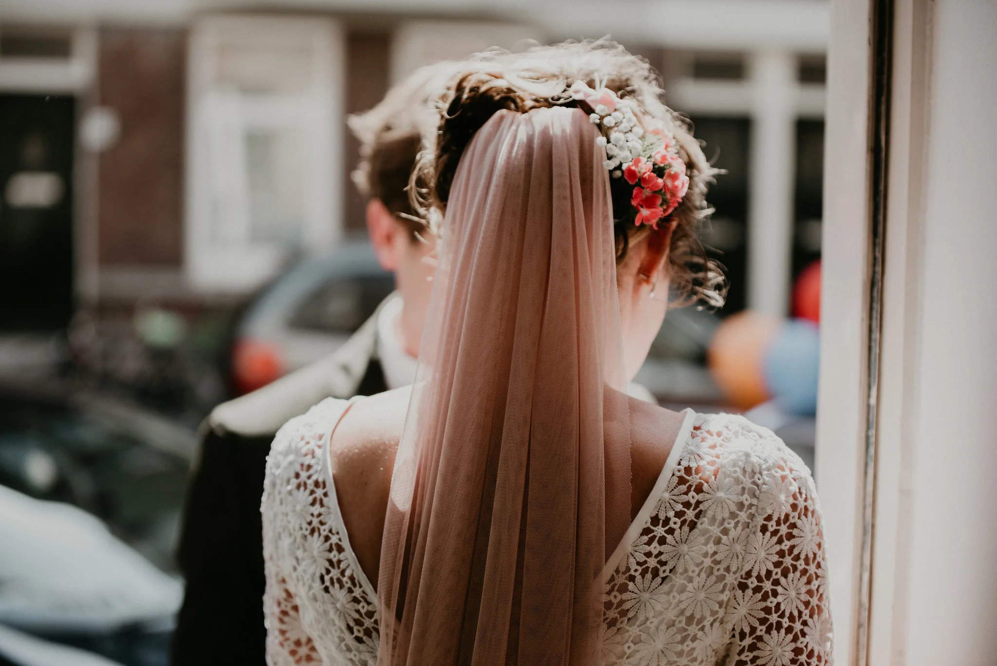 Rotterdam bride walking out the front door to see her husband for the first time