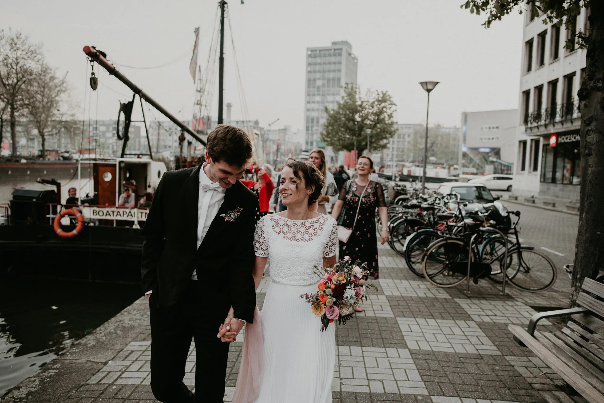 Bride and groom walking together in Rotterdam Oude Haven to Vessel 11