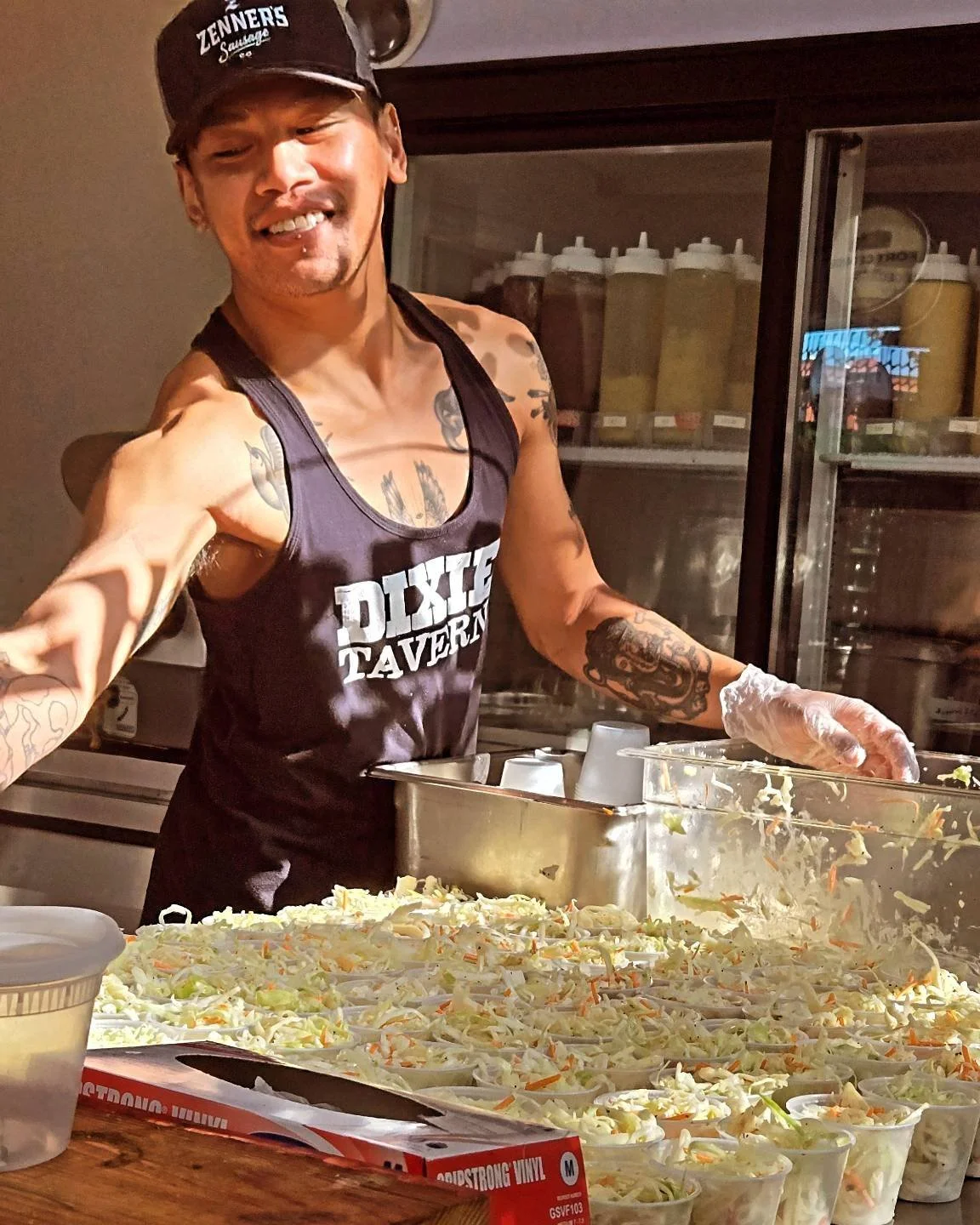 A Charlie’s Deli team member preparing food in the kitchen