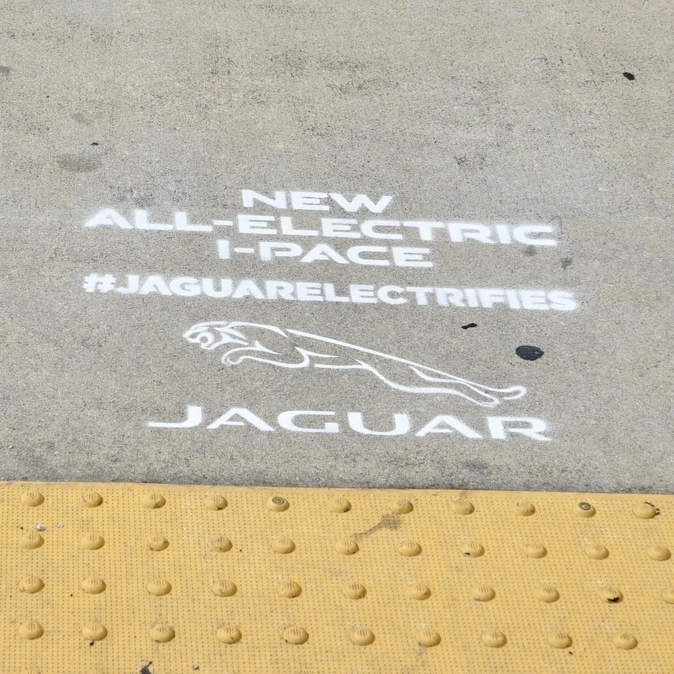 JAGUAR INTRODUCES THEIR NEW ELECTRIC CAR WITH SIDEWALK STENCILS