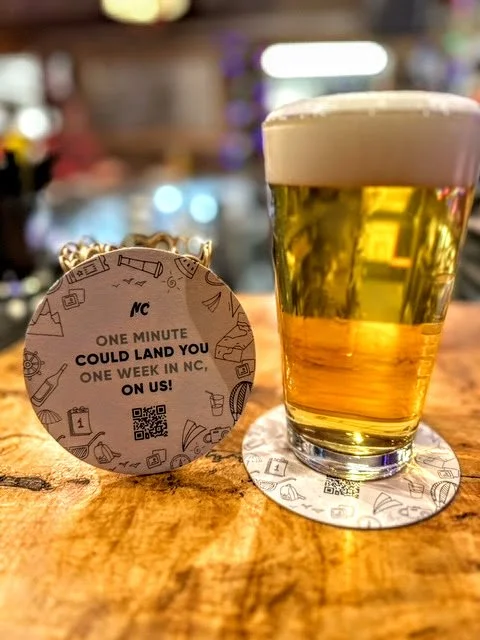 VISITNC PROMOTES NORTH CAROLINA TOURISM USING BAR COASTERS AND A CHANCE TO WIN BIG!