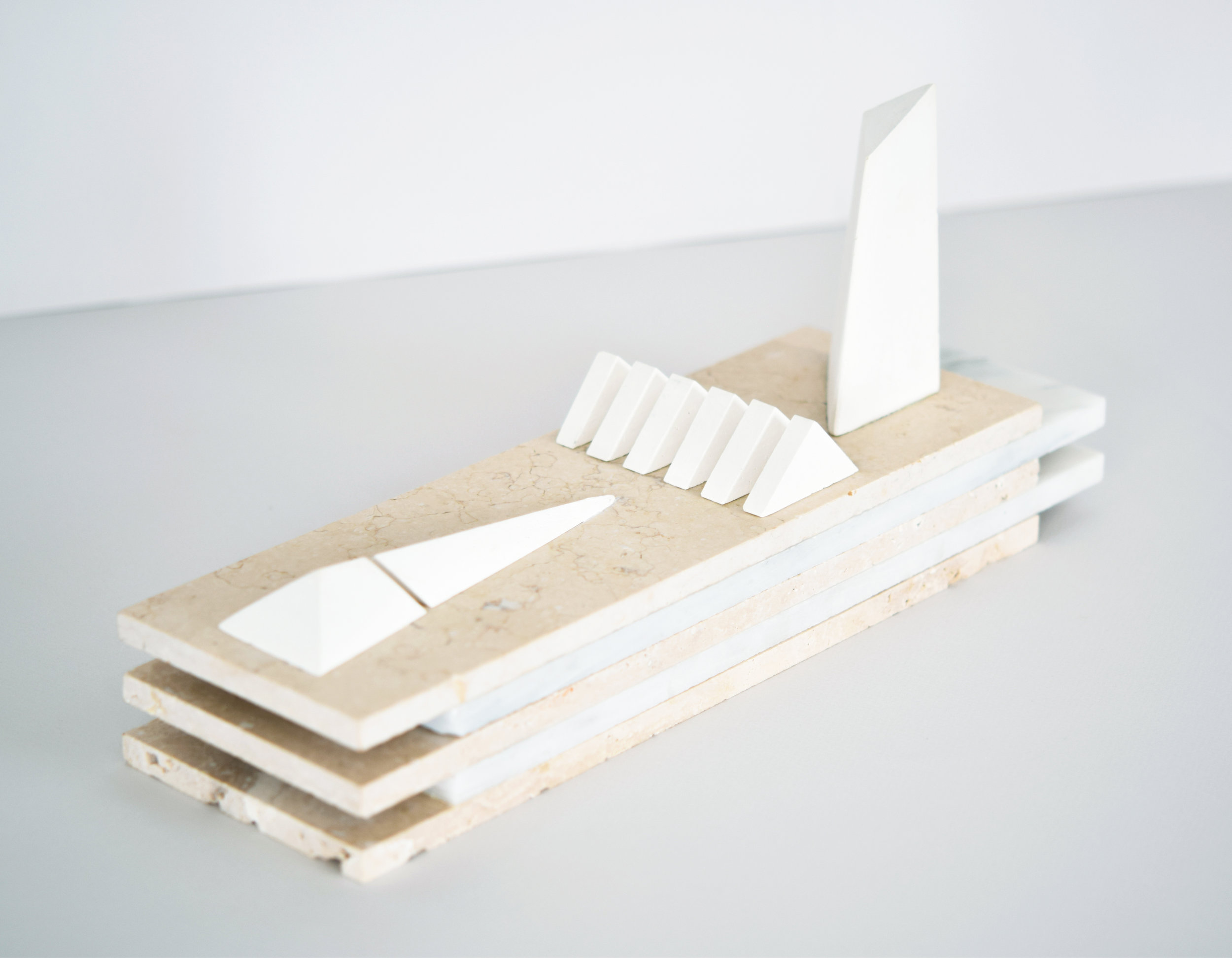   permission structures  2017 travertine, marble, cast plaster 15.5 in x 4 in x 6.5 in  