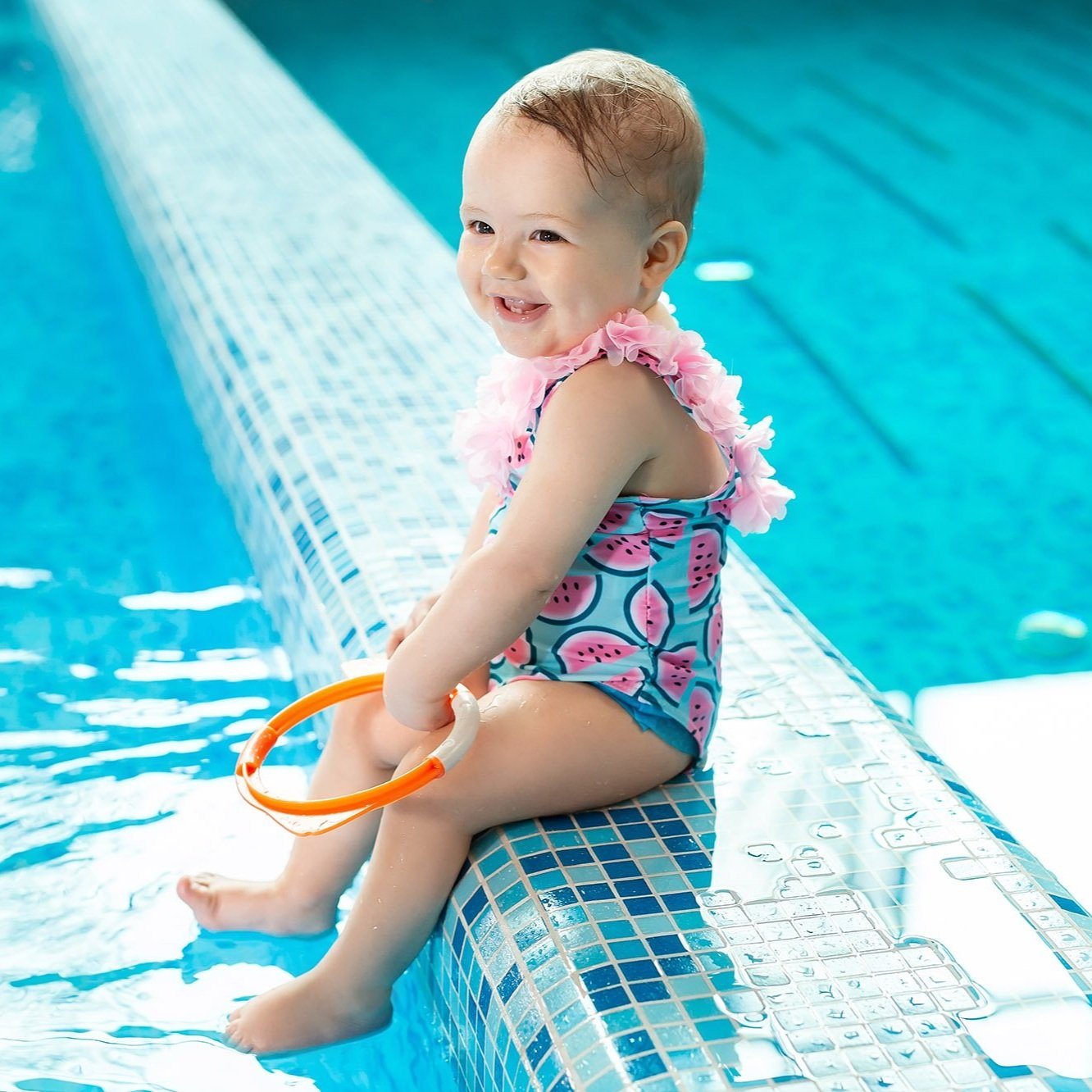 little-girl-is-laughing-in-the-pool-at-a-swimming.jpg